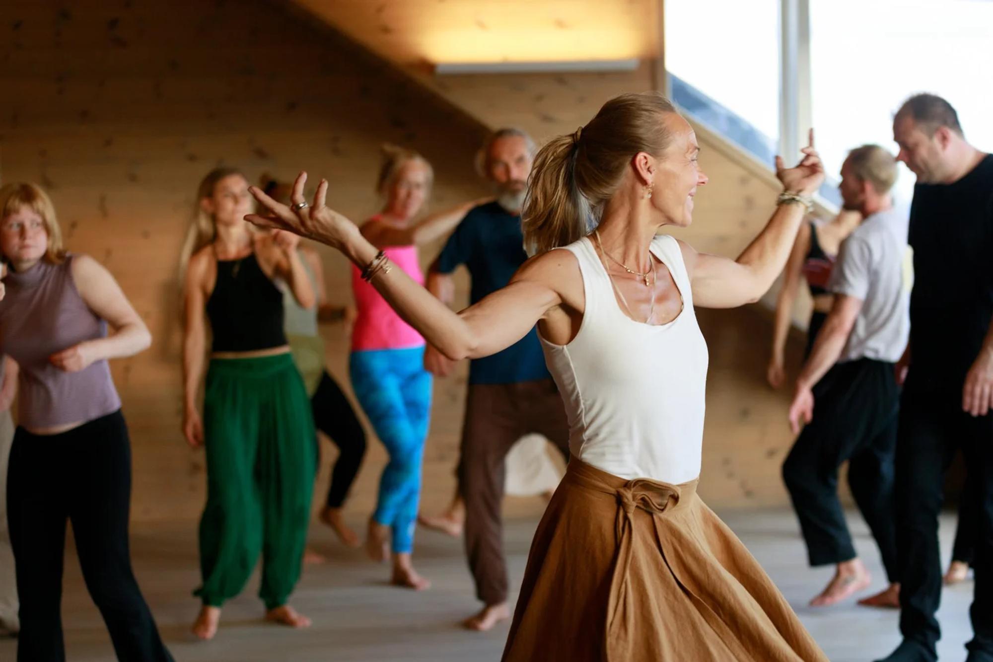 A dancer moving freely in the shala