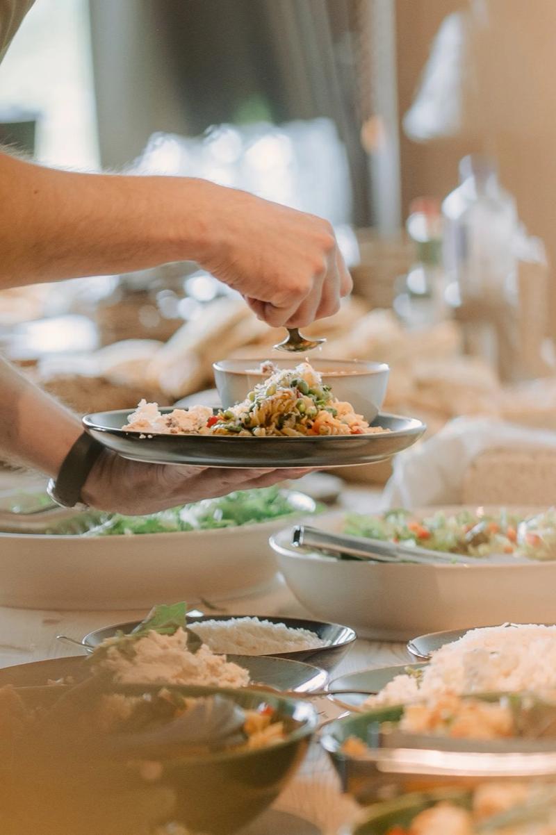 Plates being filled at the vegetarian buffet