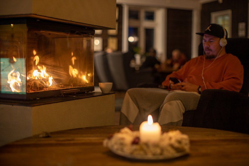 By the fireplace