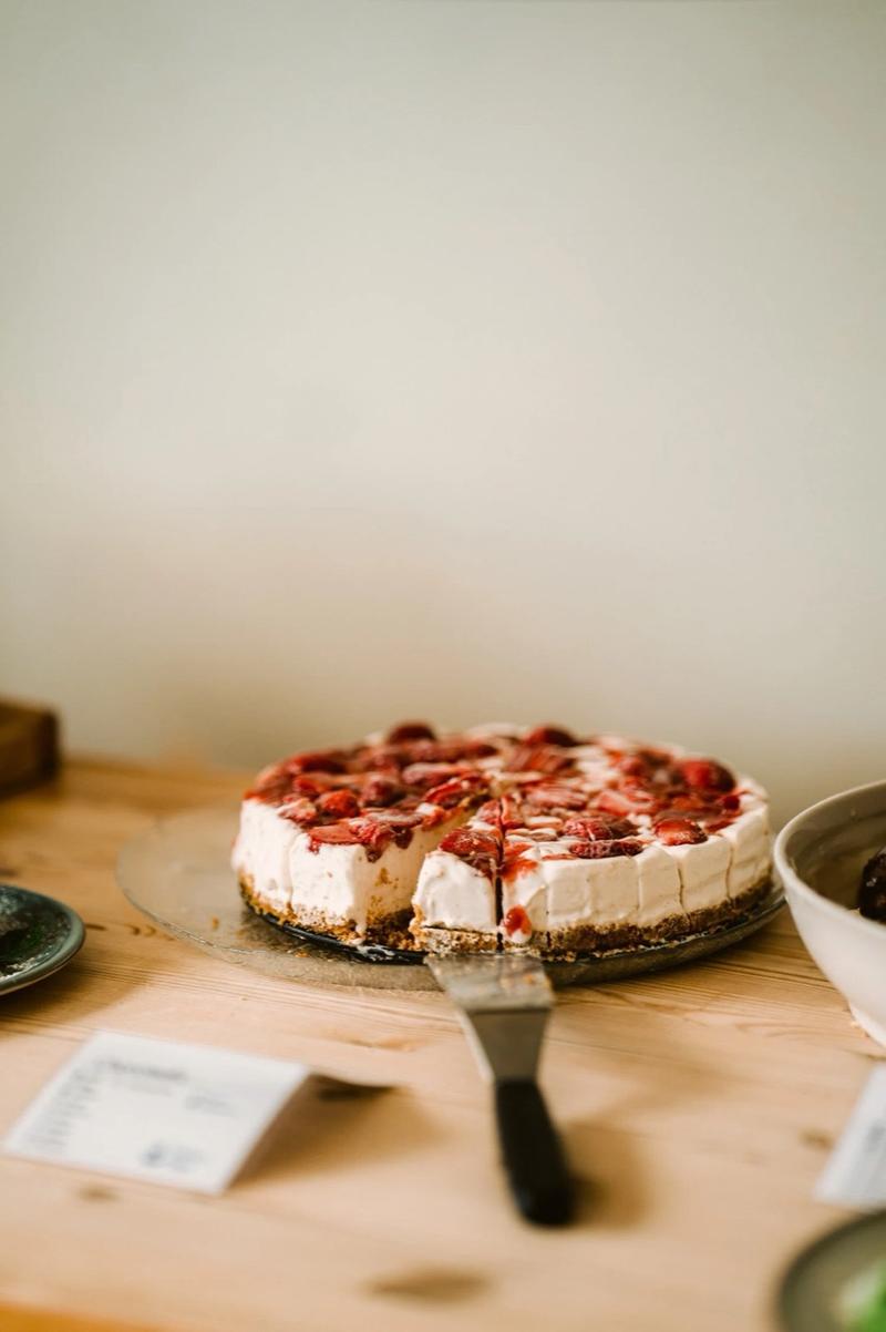 A berry cake on the café counter
