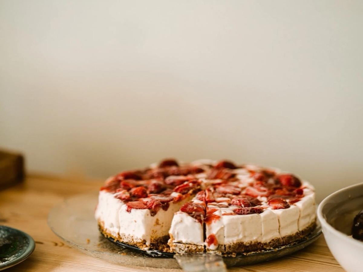 A berry cake on the café counter