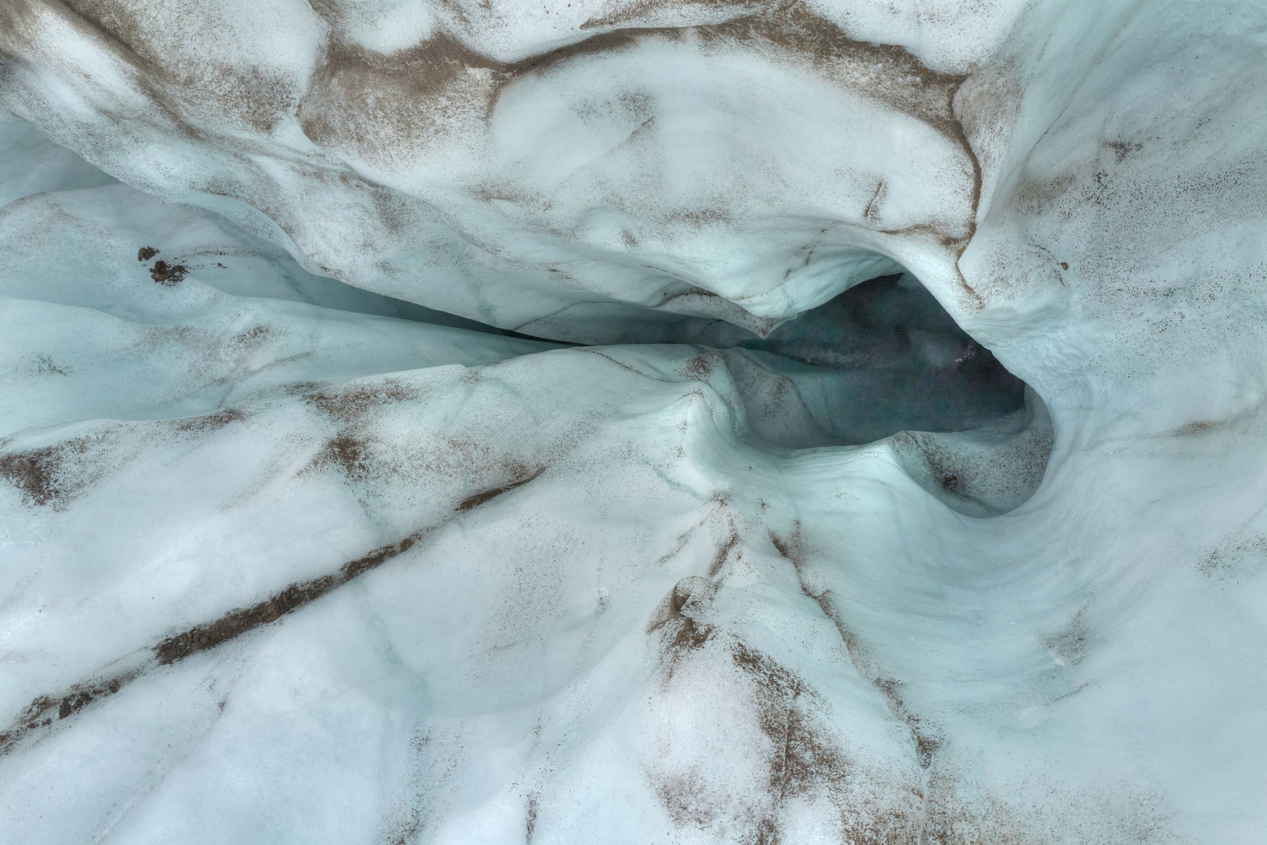 Glacier Ice — A surface of glacier ice, read close — terrain without horizon, without scale.