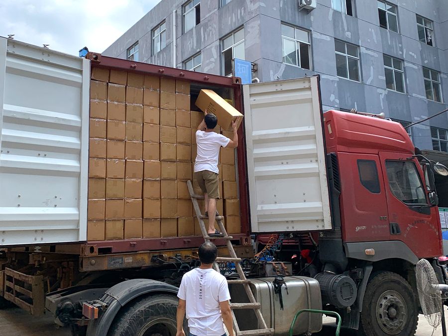 Cartons of sunglasses being loaded for shipment
