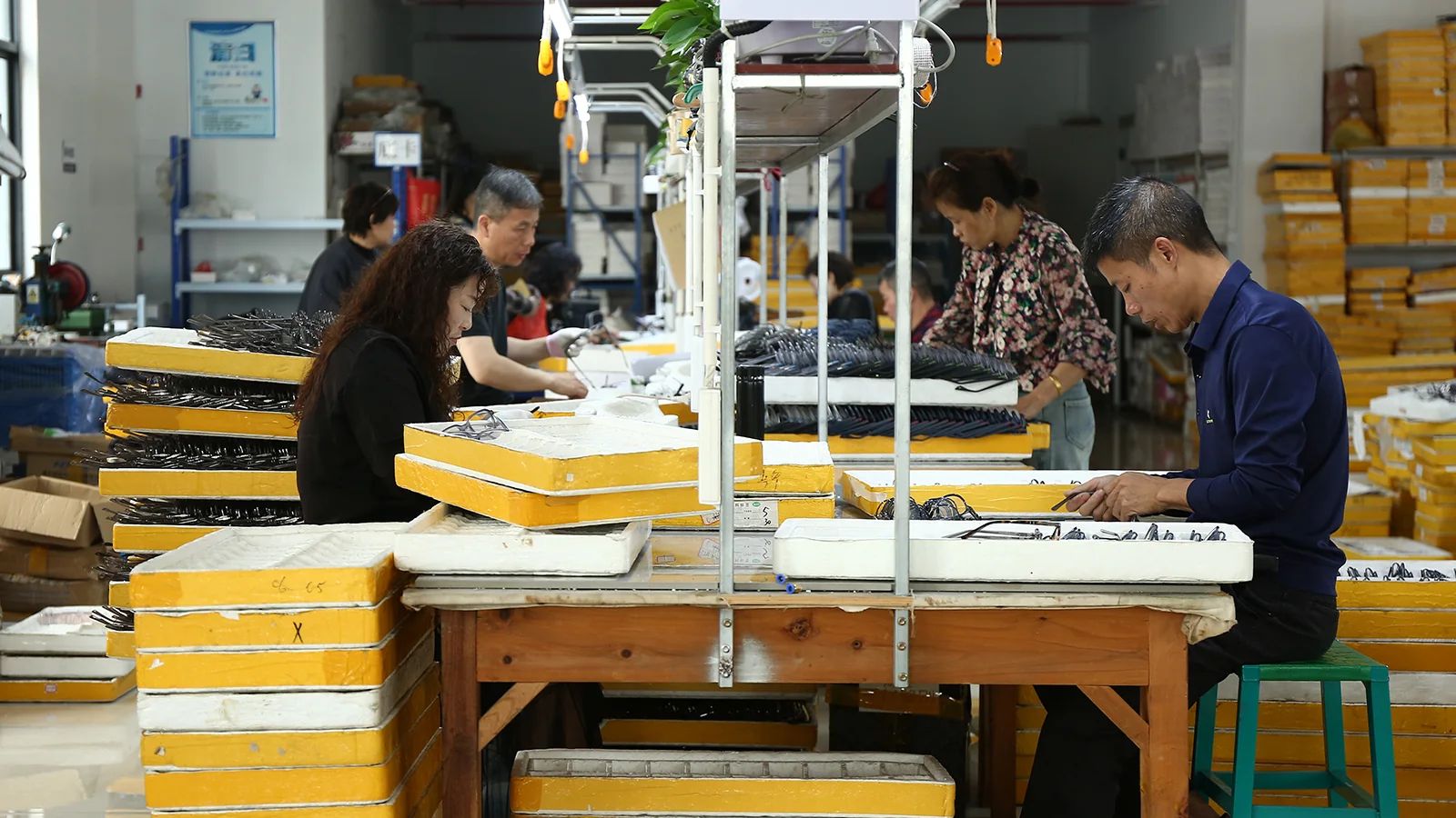 DOMI eyewear workshop assembling sunglasses for repeatable bulk production