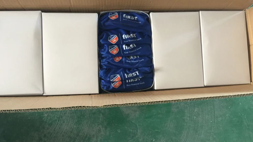Promotional sunglasses packed in individual boxes inside a shipping carton