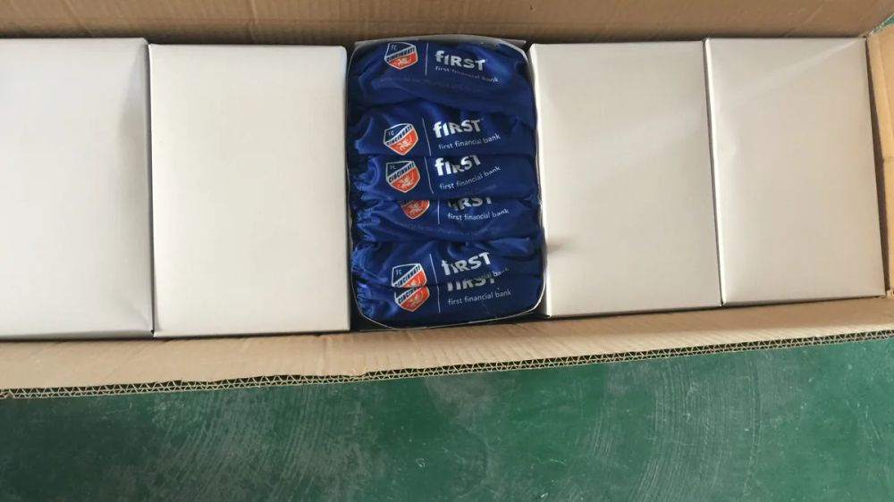 Promotional sunglasses packed in individual boxes inside a shipping carton