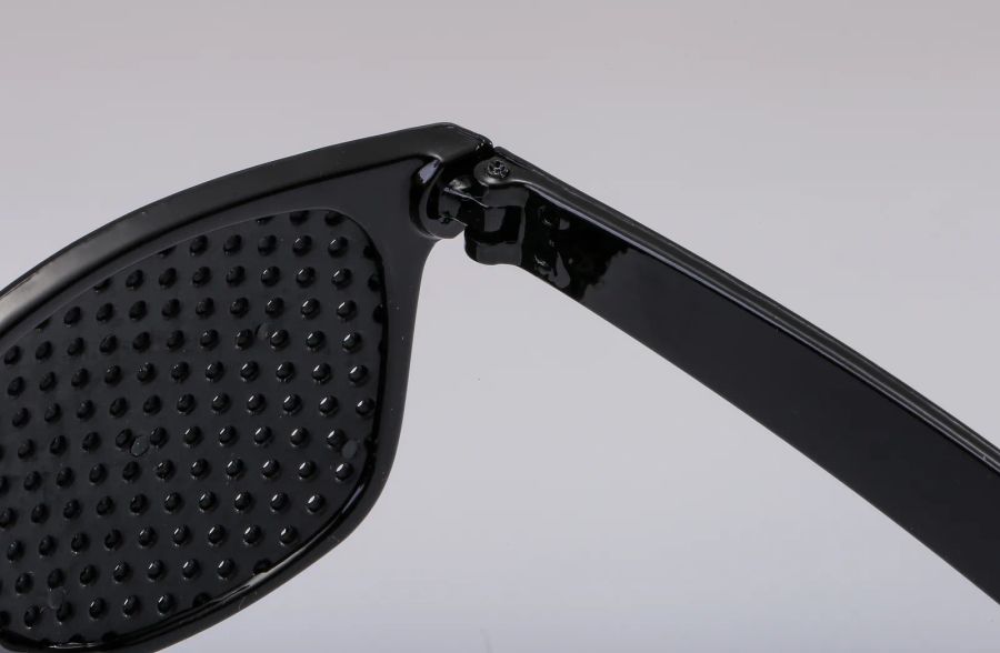 Hinge and perforated panel detail on custom pinhole sunglasses DM-580