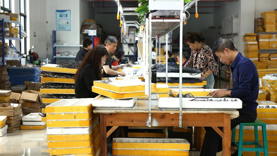 Sunglasses production and inspection at an eyewear factory