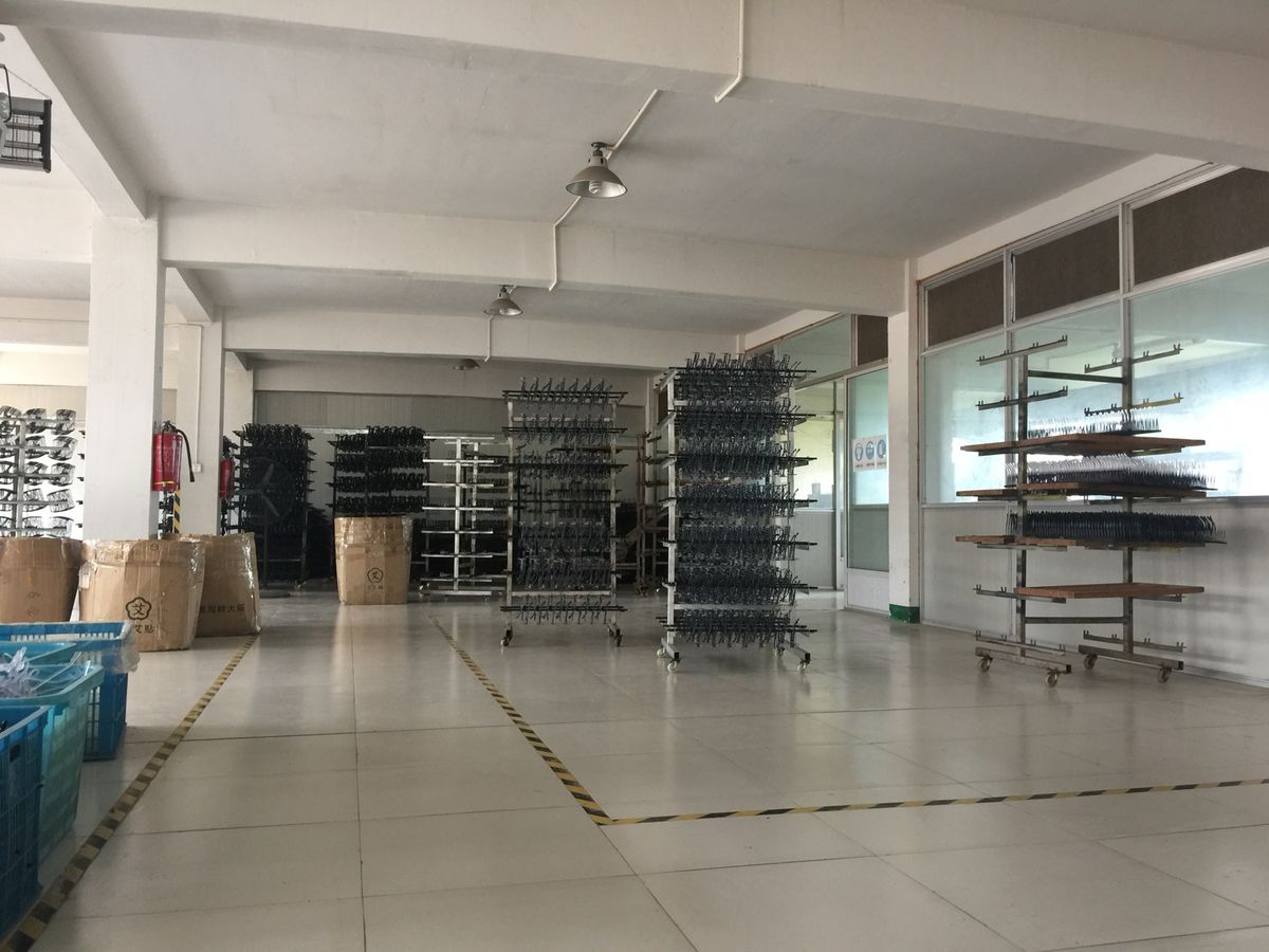 Sunglasses frame racks inside the DOMI factory workshop