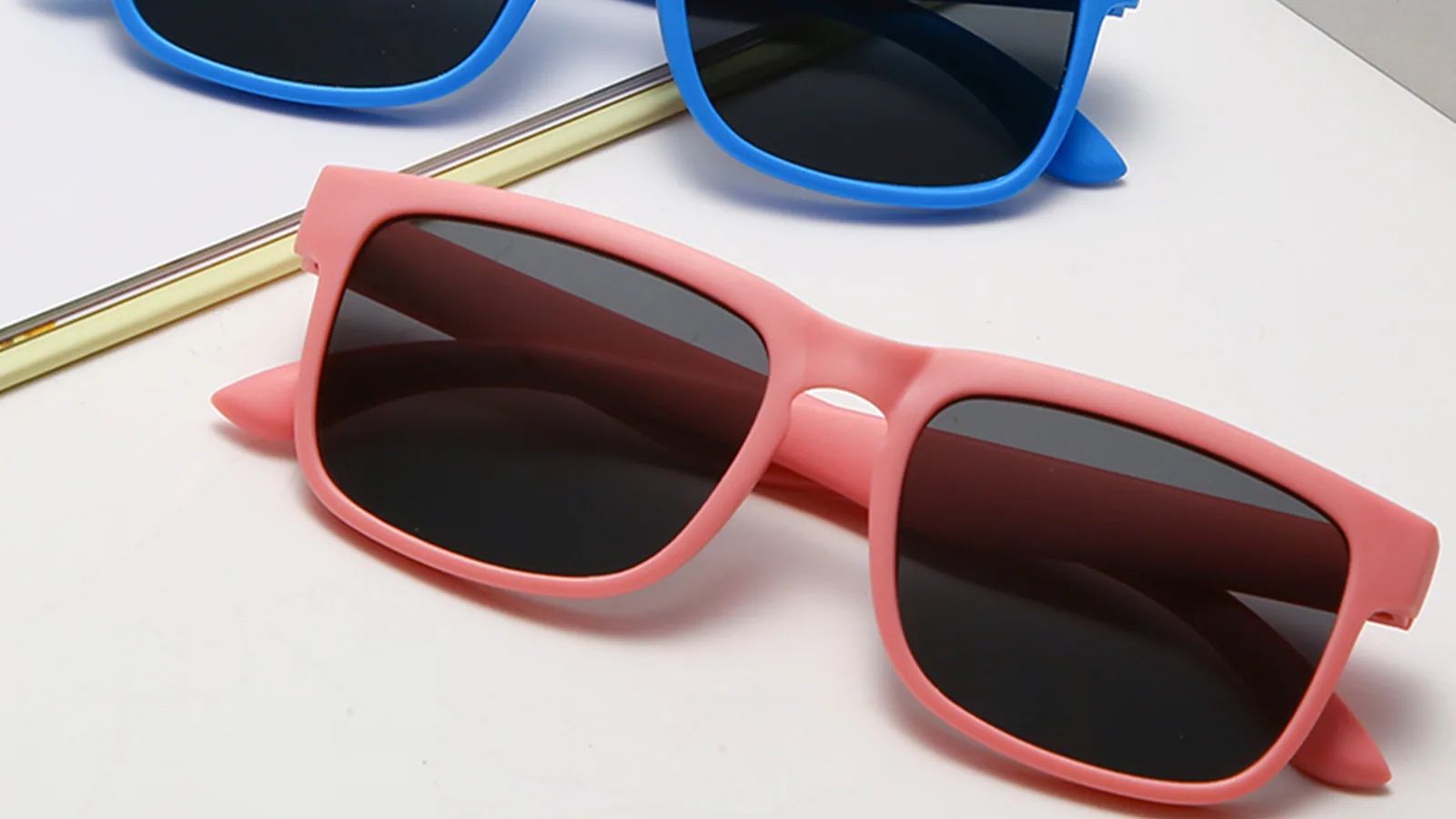 Pink and blue sunglasses used as visual references for an OEM sunglasses specification