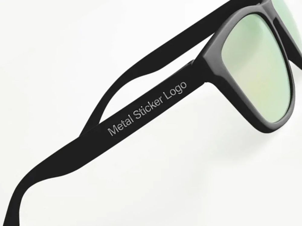 Metal logo applied to a sunglasses temple