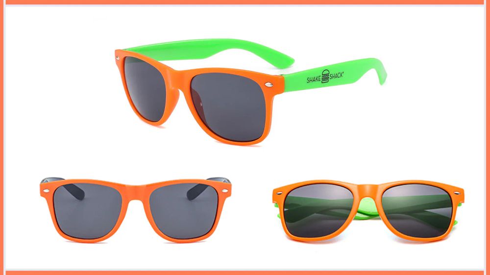 Orange and green promotional sunglasses with a logo printed on the temple
