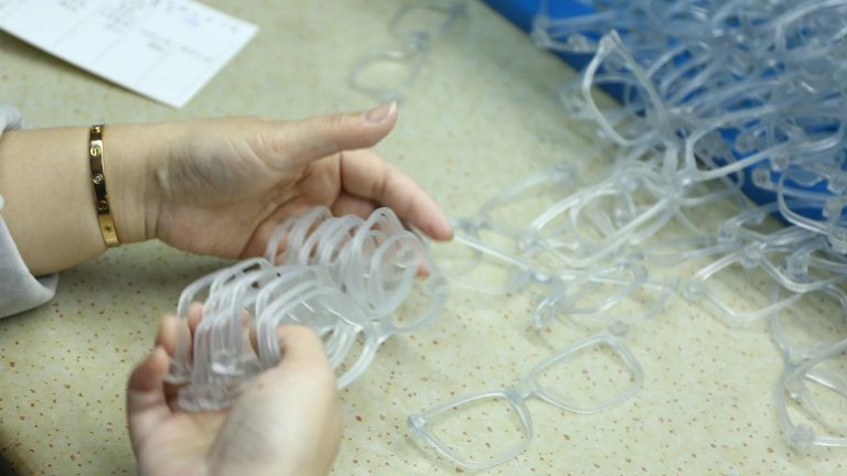 Promotional sunglasses frames being checked during production