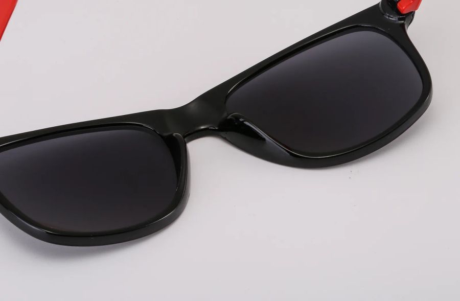Lens and frame detail on neon-colored sunglasses DM-579