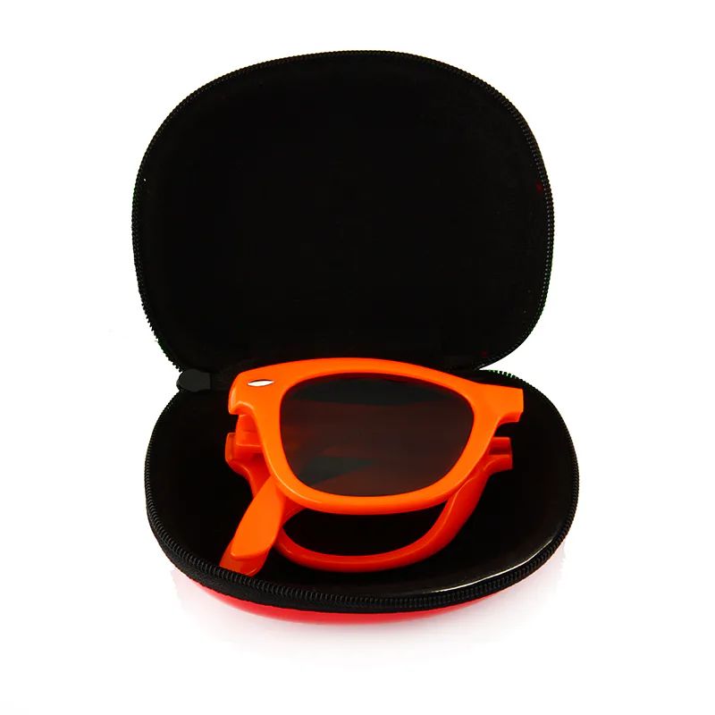 Folded orange DM-513 sunglasses inside a compact zippered case