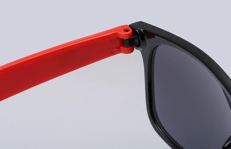 Hinge detail on neon-colored sunglasses DM-579