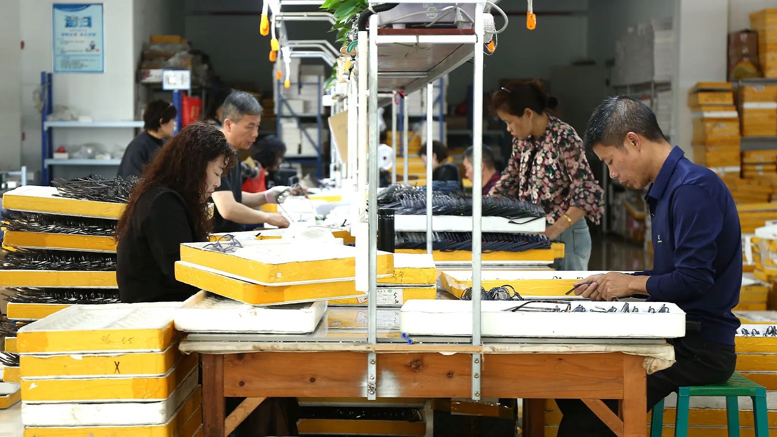 Sunglasses assembly line where in-process quality checks are performed