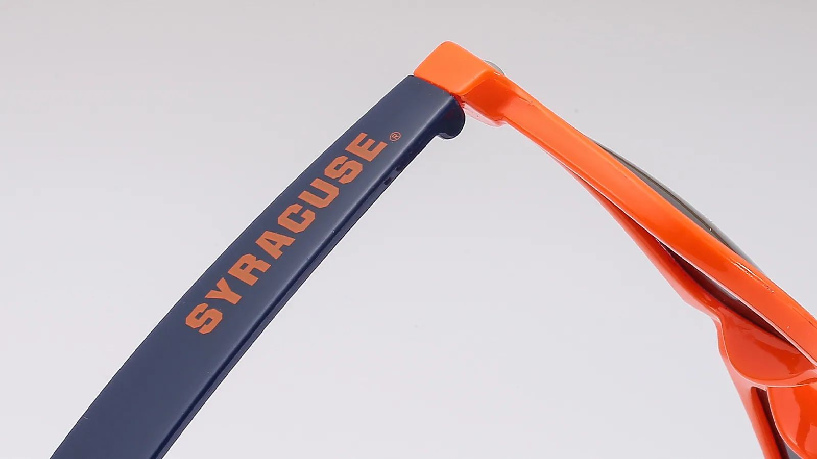 Close-up of a printed logo on a sunglasses temple for artwork and placement review