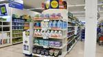 Promotional product stand in Tesco with Unilever products on the shelves
