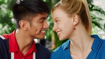 An Asian boy and American girl gaze into each other’s eyes and smile in an ad for Unilever’s Closeup toothpaste.