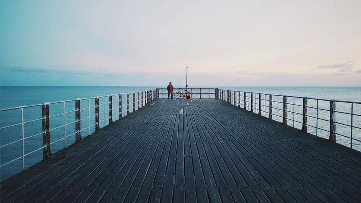 Man standing on a pier