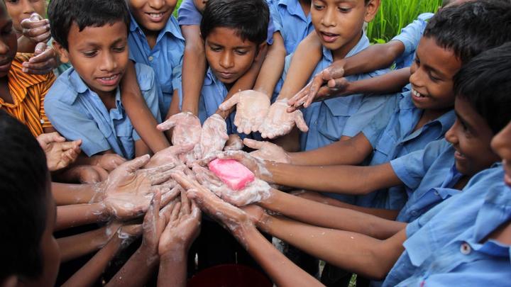 Children washing their hands with LifeBuoy soap