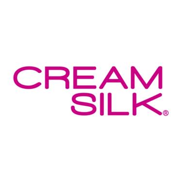 The word Cream Silk is written in big pink letters set against a white background. Cream is above the Silk word.