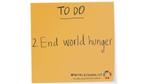 Orange sticky note with End world hunger written on it