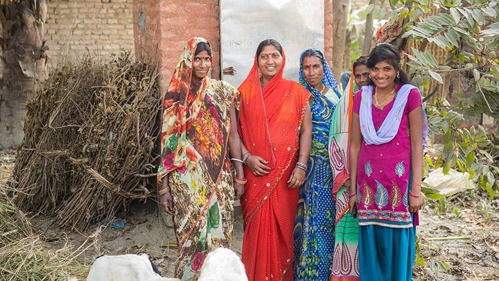 Group of Asian women outside toilet facilities