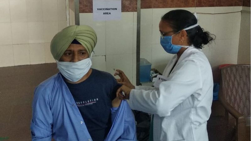 A picture of HUL's factory staff getting vaccinated for COVID19 at a vaccination camp organised by the Company.