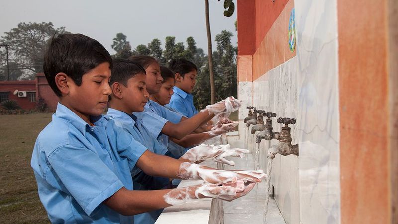 Children washing hands with Lifebuoy soap