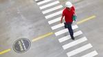 Man walking over a crossing