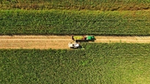 A bird’s eye view of crops being harvested in a field