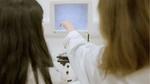 Two scientists at one of Unilever’s R&D centres looking at a screen. Both are women