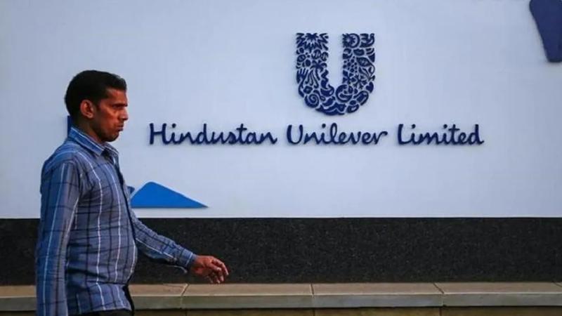 A man walking outside a Hindustan Unilever building