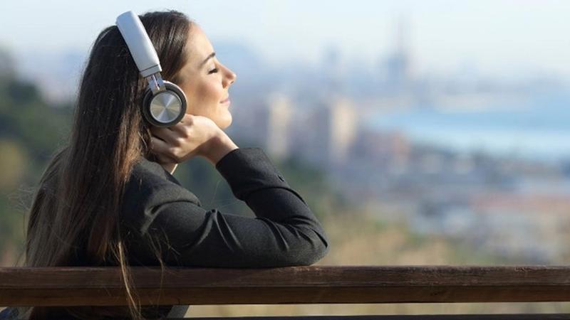 An image of a lady listening to music and relaxing 