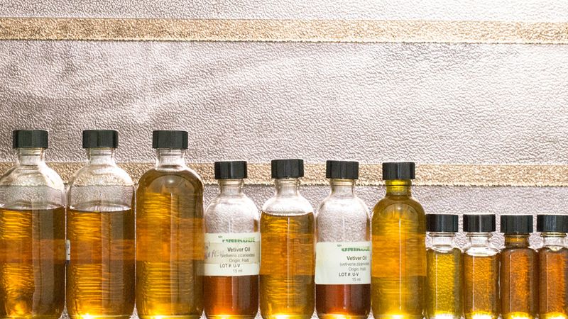 A line of bottles filled with Vetiver oil