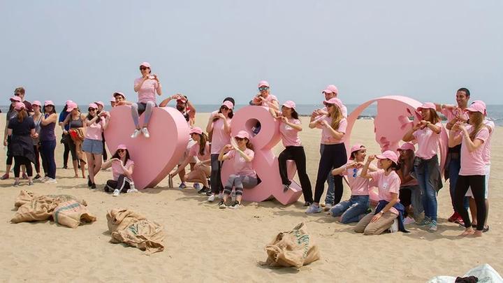 Members of the Love Beauty and Planet team dressed in pink.