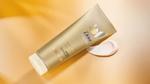 Dove Summer Revived lotion from Dove’s gradual tan range to give skin a summer glow. Product shown with amber background