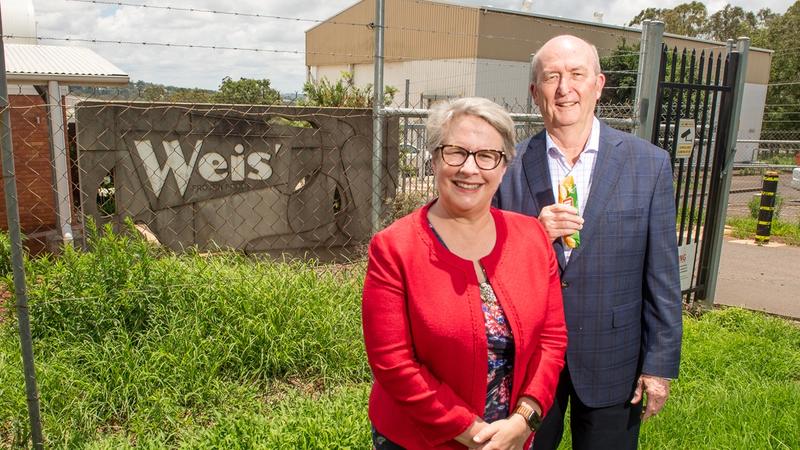 Representatives from University of Southern Queensland and Heritage Charitable Bank Foundation holding a Weis ice cream