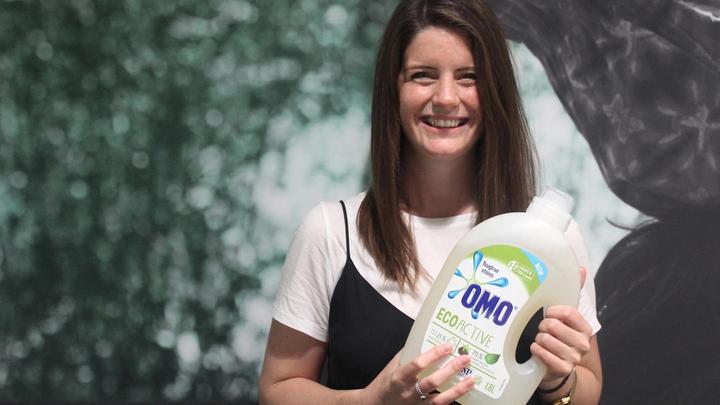 Lynsey Forrest holding a bottle of Omo Eco Active