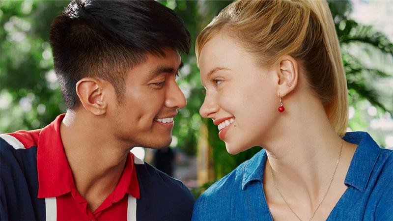 Man and woman smiling looking directly at each other