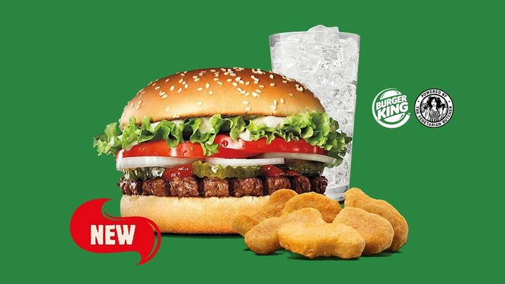 Burger King’s plant-based menu, including a Rebel Whopper burger, nuggets and a drink in a tall glass.