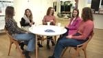 A group of five women sitting together for a round-table discussion. They are all scientists in varied roles at Unilever.