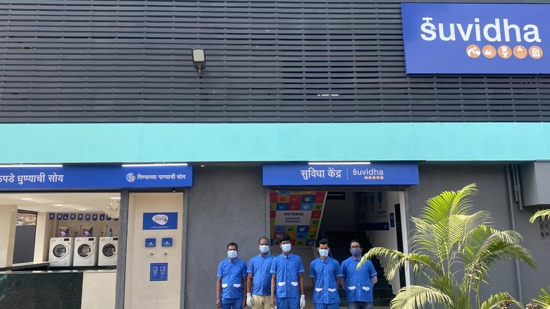 Picture of the Suvidha Centre in Dharavi Mumbai with maintenance staff in blue colour uniform