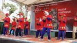 Image of seven children dancing in front of Lifebuoy poster