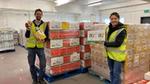 Volunteers for Unilevers charity partner Fare Share smiling with a large donation