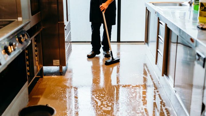 A man cleaning the floor 