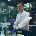 Arzeda scientist in a lab. Unilever and Arzeda use AI to develop performance-boosting enzymes for our cleaning products.