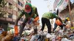 Waste workers collecting plastic from waste